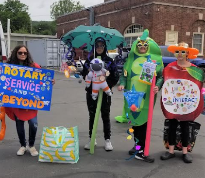 Four teens dressed up to represent a healthy eating program