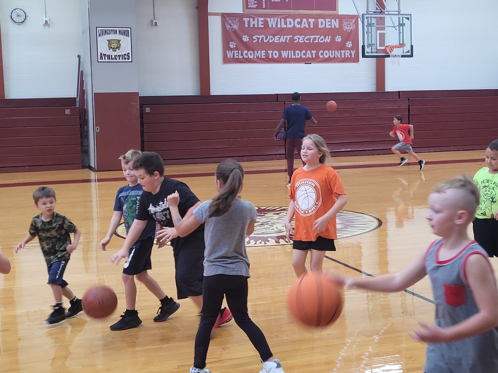 Students dribble basketballs