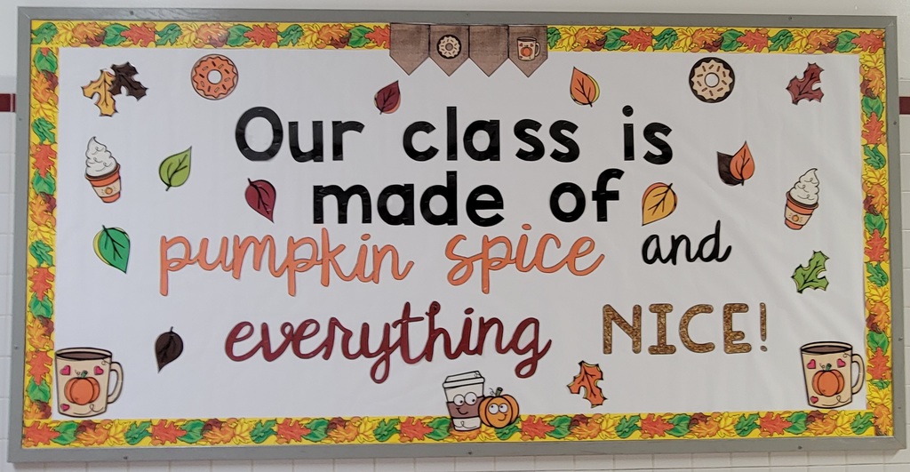 A fall themed bulletin board with a fall leaf border, pumpkins, coffee cups with the words "Our class is made of pumpkin spice and everything nice!"