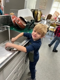 A student washes dishes