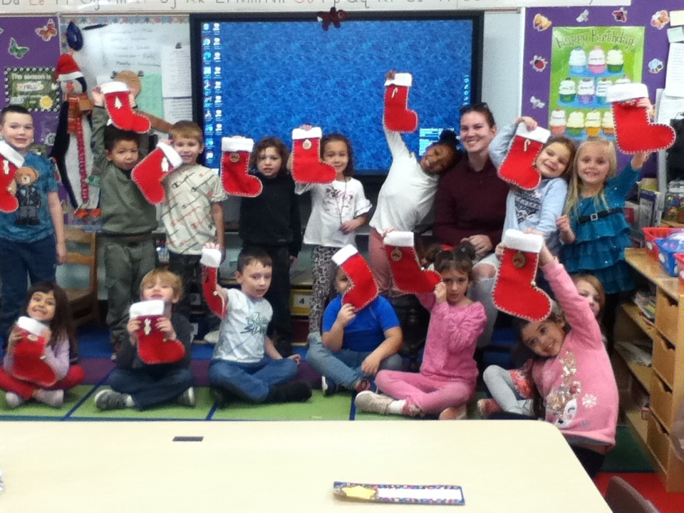 Students hold up stockings