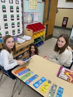 Three students read books