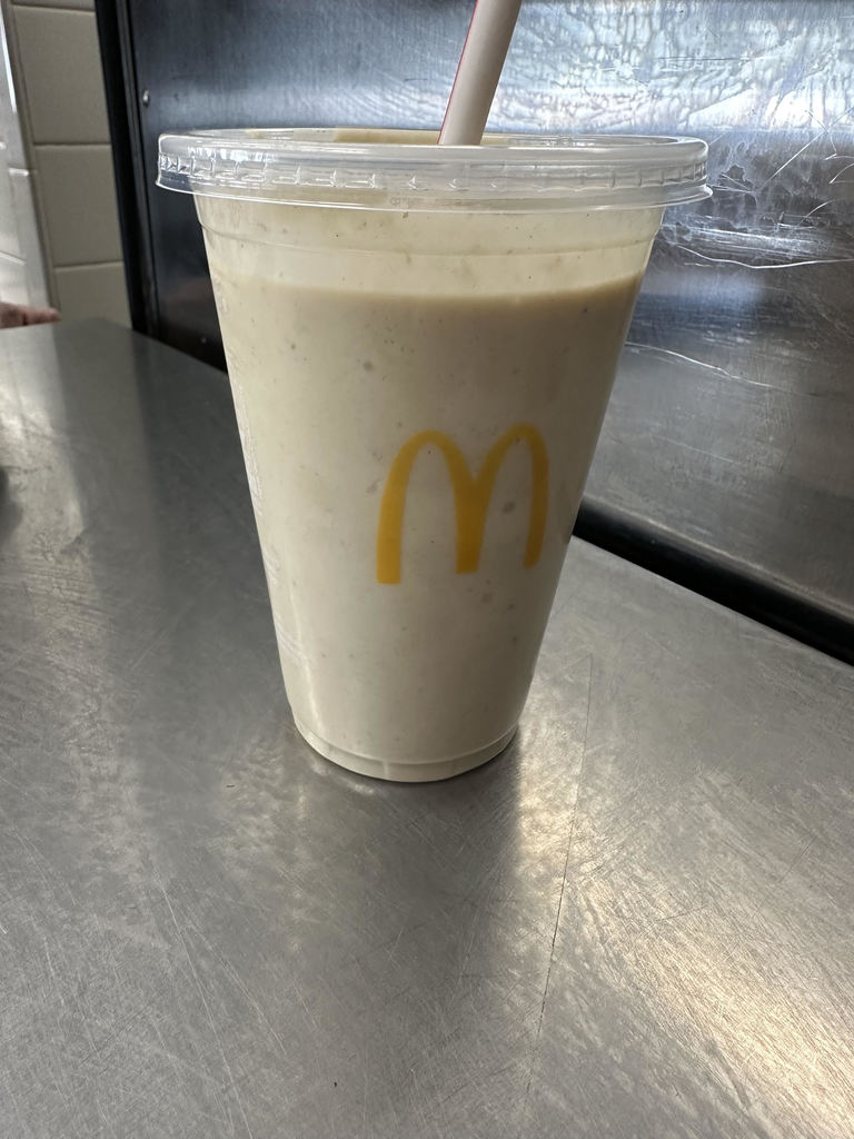 A peanut butter banana smoothie in a McDonald's cup