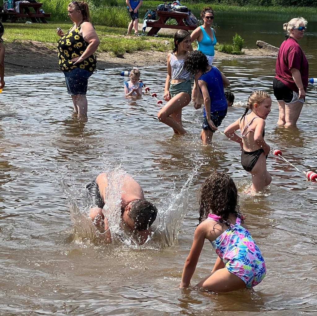 Students and others play in the water